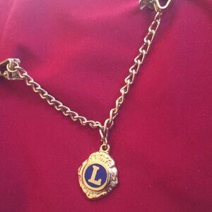 Gold Chain Bracelet with Blue Emblem